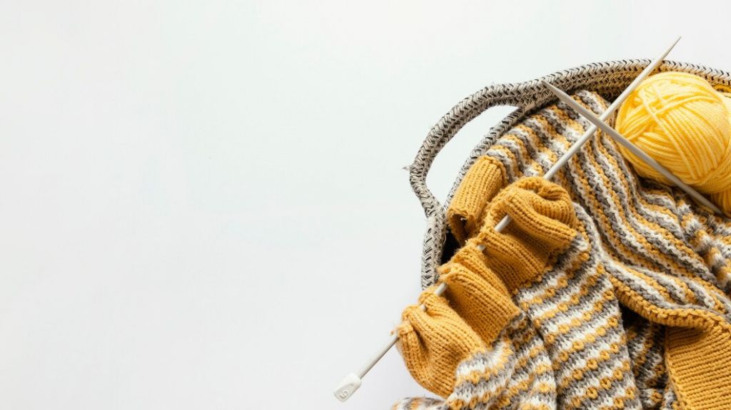 knitting-needles-wool-basket-with-copy-space_23-2148859150.jpg