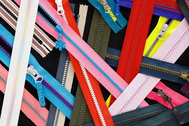 zip-background-texture-of-zippers-sliders-a-lot-of-zippers-in-different-colors-sewing-clothes-atelier-fabric-and-accessories-shop-hobby-diy-concept_263512-3671.jpg
