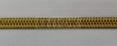 Рулонная молния спиральная (витая) тип 5 декоративная цв 101 зв золото (рул 200м/уп 2000м)